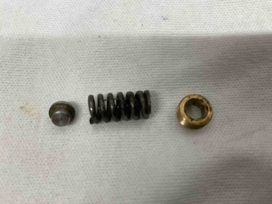 Spring, seat, set screw